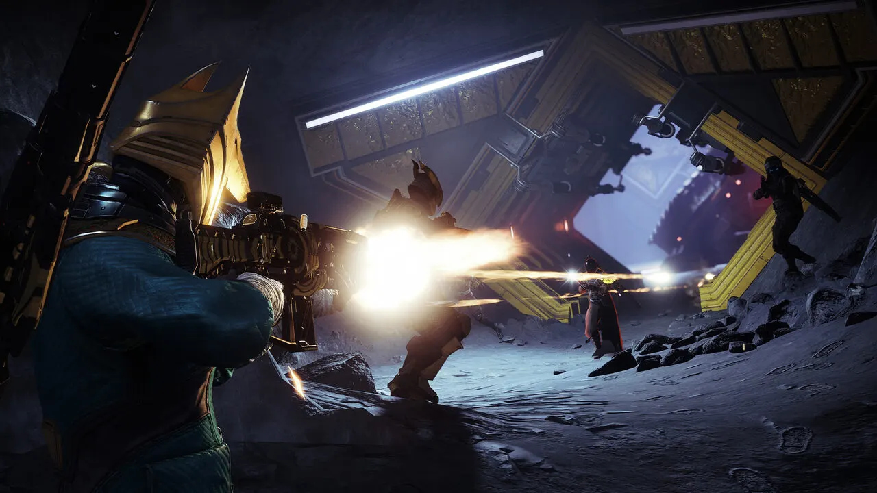 Fireteam of three Guardians firing on enemies in a snowy cavern in Destiny 2